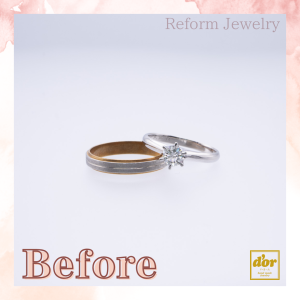 婚約指輪と結婚指輪を組み合わせて作った二重リングのペンダントネックレス。中央にダイヤモンドが揺れる華やかなデザイン